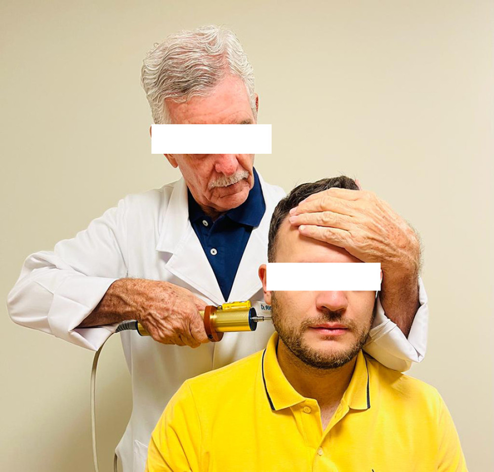 Health care professional trained in the Atlasprofilax method applying the intervention on a Brazilian patient.