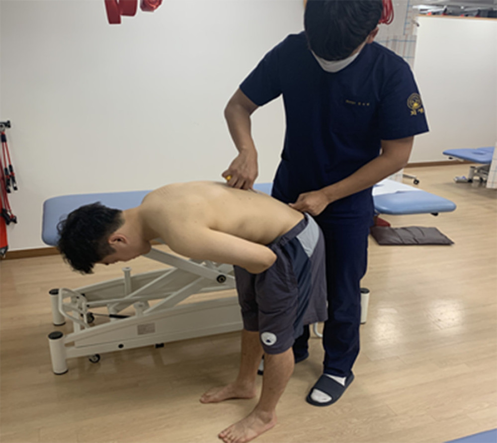 Lumbar forward flexion measurement in the standing position.