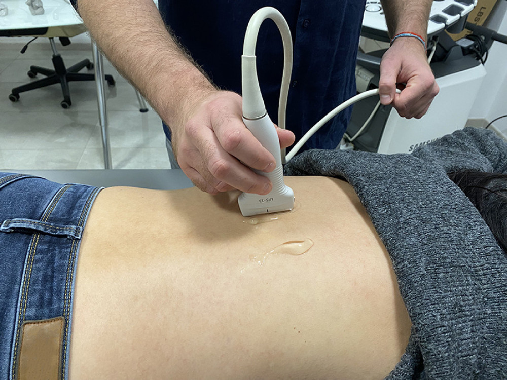 Sham therapeutic technique, using ultrasound on the patient’s back.